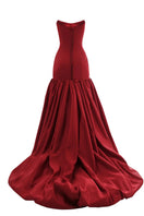 Elegant CULT MIA X Monetre black gown with intricate detailing, shown on a model, showcasing its flowing fabric and stylish design.