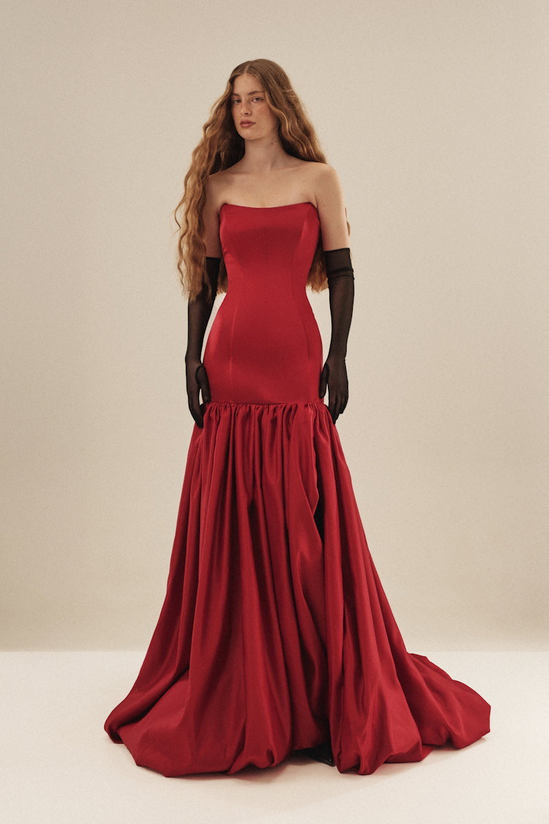 Elegant black gown by Monetre from the CULT MIA X MONETRE collection, featuring a flowing silhouette and intricate details.