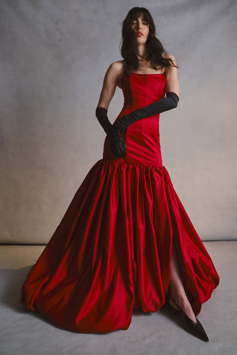 Elegant black gown by Monetre from the CULT MIA X MONETRE collection, featuring a flowing design and sophisticated style.