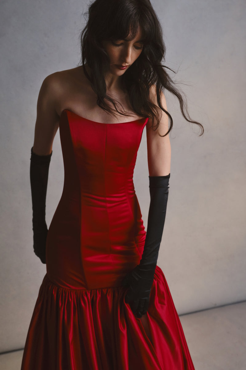 Elegant black gown from Monetre's CULT MIA X MONETRE collection, featuring a flowing design and sophisticated style.