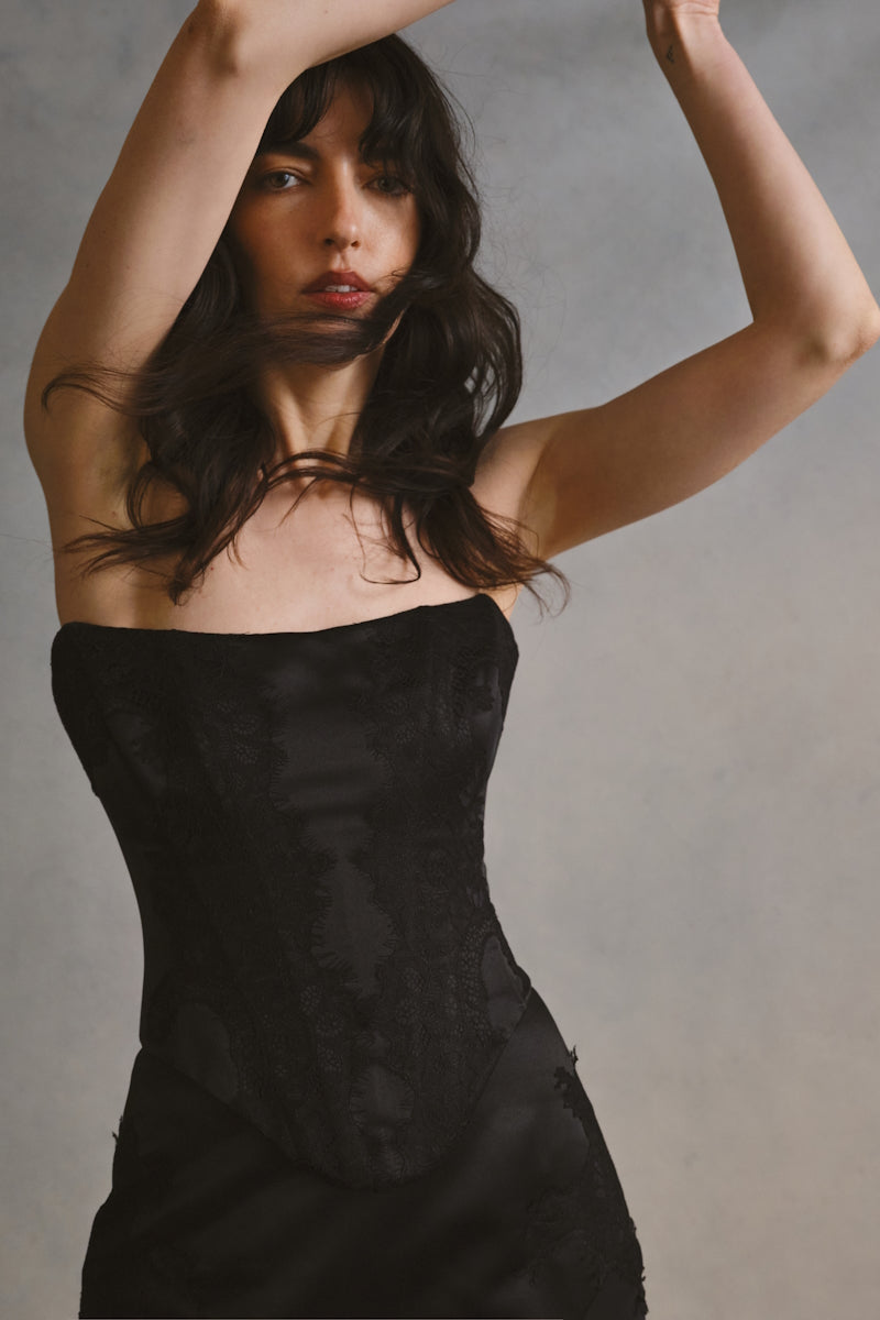 Black lace co-ord set by Monetre, featuring a stylish crop top and matching high-waisted pants, perfect for a chic look.