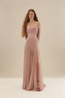 Elegant CULT MIA X MONETRE CÉLINE gown in flowing fabric, featuring intricate detailing and a sophisticated silhouette.
