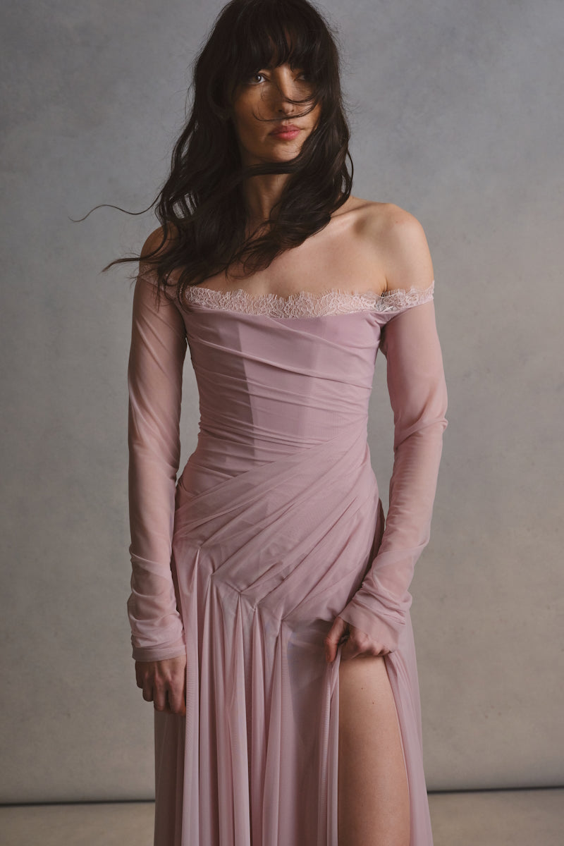 Elegant CULT MIA X MONETRE CÉLINE gown with flowing fabric and intricate design, showcased on a model.