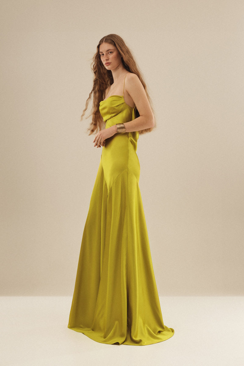 Monetre Cult Mia X Monetere Viride gown with flowing fabric and elegant design, showcased on a model.