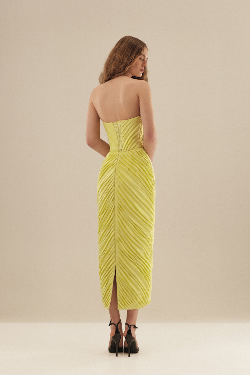 Monetre Cult Mia X Monetre Margot midi dress displayed on a hanger with floral pattern and flowy silhouette.