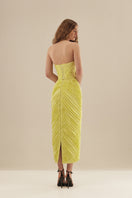Monetre Cult Mia X Monetree Margot midi dress with floral pattern, flowing fabric, and elegant design on a model.