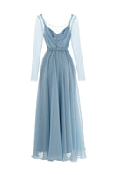 Monetre CULT MIA X MONETRE ÉTHER maxi dress in flowing fabric, showcasing its elegant design and vibrant pattern.