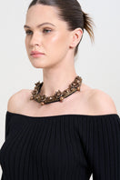 Model wearing a gold alloy necklace from Aidan & Ice, featuring a sleek, stylish design perfect for everyday wear.