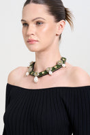 Model wearing a green alloy necklace from Aidan & Ice, featuring a stylish and vibrant jewelry piece for everyday wear.