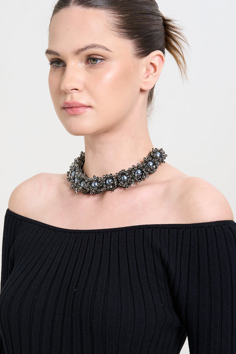 Model wearing the GREYN LUSH necklace by Aidan & Ice, featuring a stylish, layered silver chain necklace.