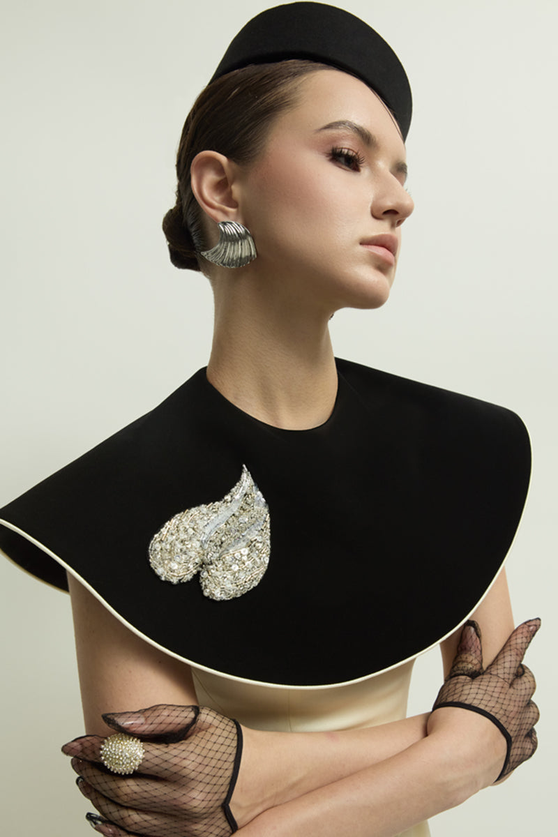 Black and ivory Montpellier gown by Jenny K Tran, featuring elegant fabric and intricate design details.