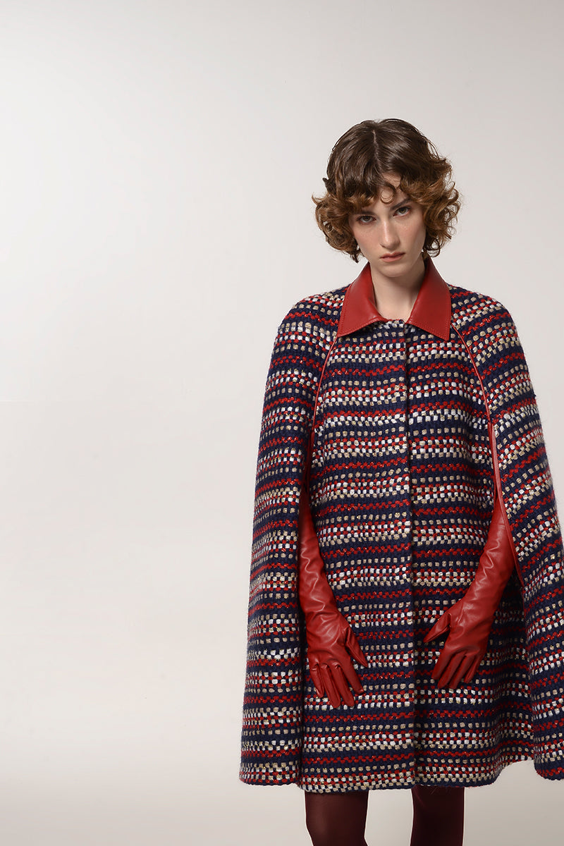 Lalo brushed red wool cape coat displayed on a hanger, showing its textured fabric and stylish design suitable for cold weather.