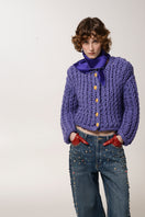 Purple cable knit wool cardigan by Lalo, showing close-up of textured knit pattern and cozy fit on a model.
