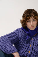 Purple cable knit wool cardigan by Lalo, featuring textured pattern and cozy fit, displayed on a hanger.