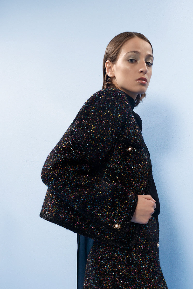 Lalo brown checkered wool mini skirt with a fitted waistband and classic plaid pattern, styled for a trendy casual look.
