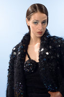 Lalo Midnight Dreams mohair cardigan displayed on a hanger, featuring a soft, cozy knit with a relaxed fit and subtle color details.