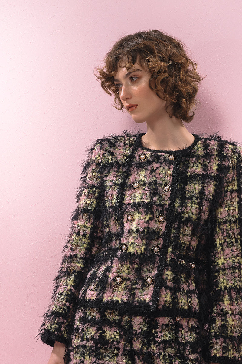 Black textured wool jacket by Lalo, shown on a hanger, featuring a tailored collar and stylish, cozy design.