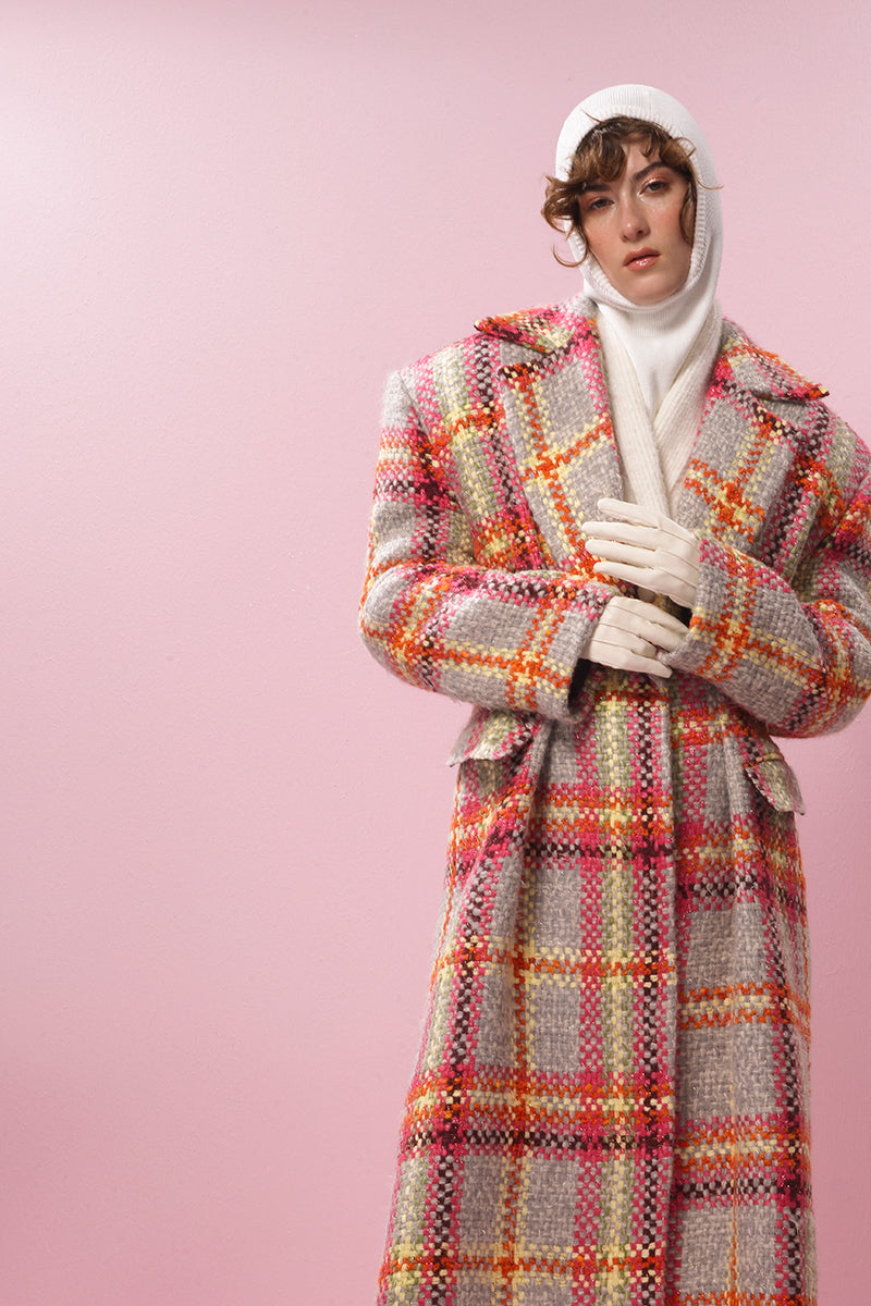 Lalo Mandarin Muse wool coat displayed on a hanger, showcasing its tailored fit and classic design in neutral tones.