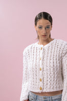 White cable knit wool cardigan by Lalo, featuring a cozy textured knit with a button-up front and ribbed cuffs.