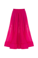 Lalo fuchsia silk maxi skirt draped elegantly, showcasing flowing fabric and vibrant color ideal for stylish summer outfits.