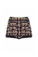 Black textured wool mini skirt by Lalo, showcasing a stylish fitted design with a high waist and textured fabric detail.