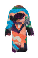Lalo peach landscape mohair coat hanging on a wooden hanger, showcasing its soft texture and stylish design.