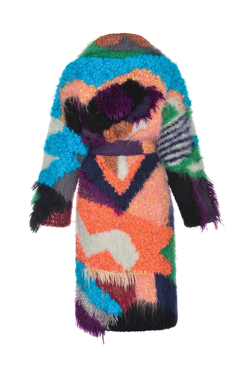 Lalo peach landscape mohair coat hanging on a wooden hanger, showcasing its soft texture and stylish design.