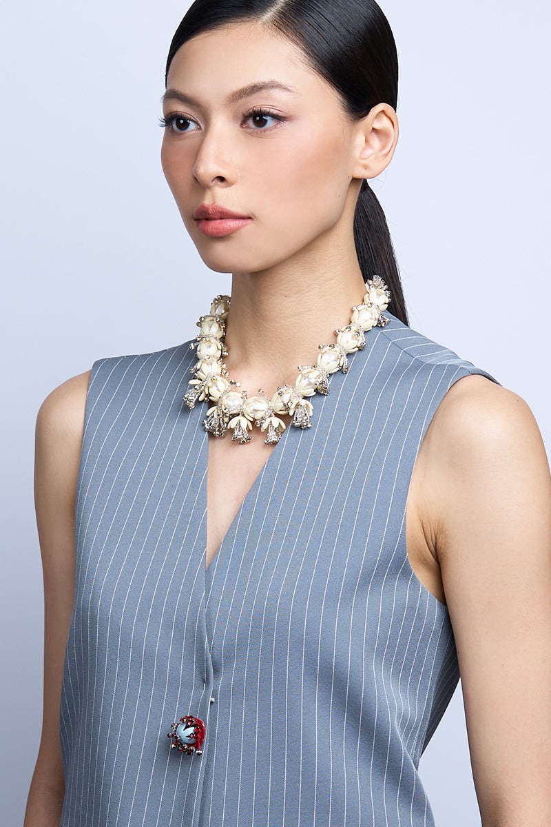 Aidan & Ice Solace white necklace with a delicate chain and minimalist pendant, styled for a modern, elegant look.