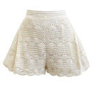 Ivory crochet shorts by Andrea Iyamah with detailed knit pattern and relaxed fit, perfect for warm weather.