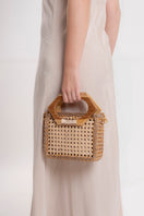 Mara Brazil MURIA top handle bag in beige with sleek design and gold-tone hardware, featuring a structured shape and stylish leather finish.