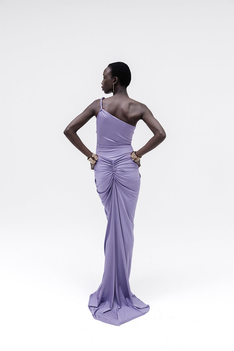 Studio NK violet gown, Muse Dress, elegant evening dress with flowing fabric and fitted waist, shown on a mannequin.