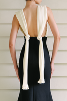 Maylé Vásquez Chavon black and white gown featuring elegant design and flowing fabric perfect for formal occasions.