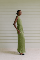 Black Maylé Vásquez Constante sleeveless maxi dress displayed on a hanger, showcasing its flowing fabric and elegant design.