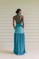 Maylé Vásquez Cayo Turquoise Maxi Dress featuring flowing fabric and a stylish design, perfect for casual or formal occasions.