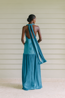 Maylé Vásquez Cayo Turquoise Maxi Dress featuring flowing fabric and a stylish silhouette, perfect for elegant summer occasions.