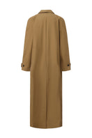 Long brown trench coat with a collar from Chictopia, shown on a model, featuring classic design and stylish details.