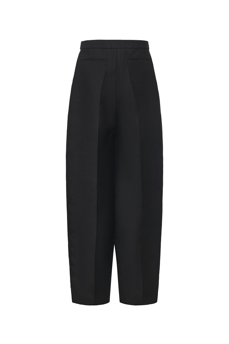 Chictopia Elodie wide-leg pleated trousers in beige, showcasing their relaxed fit and high waist design.