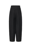 Chictopia Elodie wide-leg pleated trousers in beige, showcasing their relaxed fit and high waist design.