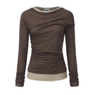 Chictopia layered jersey top with a stylish, casual design featuring multiple fabric layers and a relaxed fit.