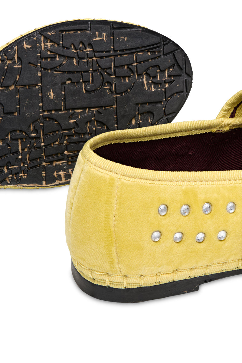 Flabelus Mae Cristal yellow flats with yellow piping, showcasing a sleek design and comfortable slip-on style.