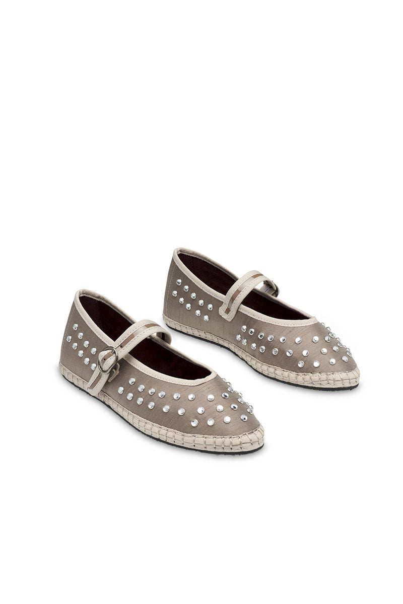 Flabelus Mae grey flats with pointed toes and slip-on design, shown on a model's feet against a neutral background.