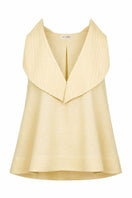 Yellow Magnolia blouse by ANA + MARIA displayed on a ghost mannequin, featuring lightweight fabric and a relaxed fit.