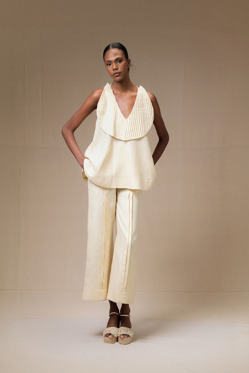 ANA + MARIA Magnolia blouse in butter yellow, lightweight top with a relaxed fit, shown on a model.