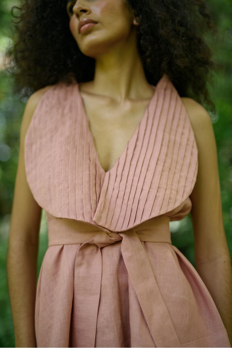 ANA + MARIA Magnolia blouse in dark salmon, stylish women's top with a flowy fabric, displayed on a model.