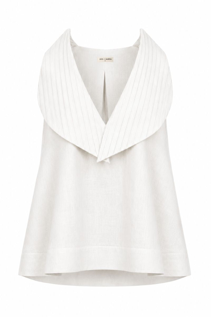 White Magnolia blouse by Ana + Maria displayed on a ghost mannequin, showcasing its lightweight fabric and classic fit.