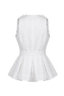 White Magnolia blouse by Ana + Maria displayed on a ghost mannequin, showcasing its flowy fabric and elegant design.