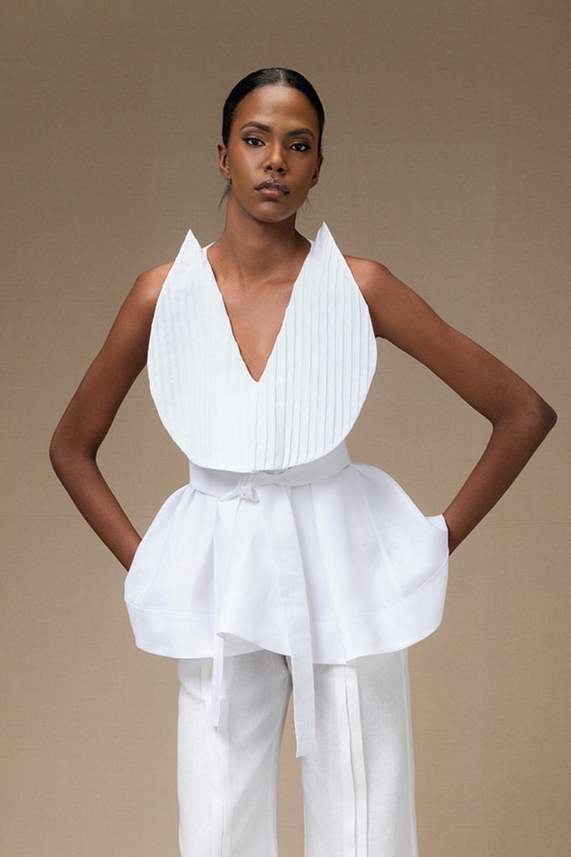 White Magnolia blouse by ANA + MARIA, featuring lightweight fabric and a stylish, feminine design perfect for casual or dressy outfits.