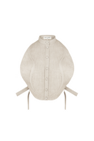 ANA + MARIA Malie Bib in sand, a stylish top with a soft fabric and relaxed fit, shown in a neutral sand color.