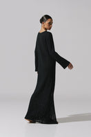 Black Baobab MAMU MAXI dress, flowing maxi dress with elegant design, showcased on a model, perfect for stylish occasions.