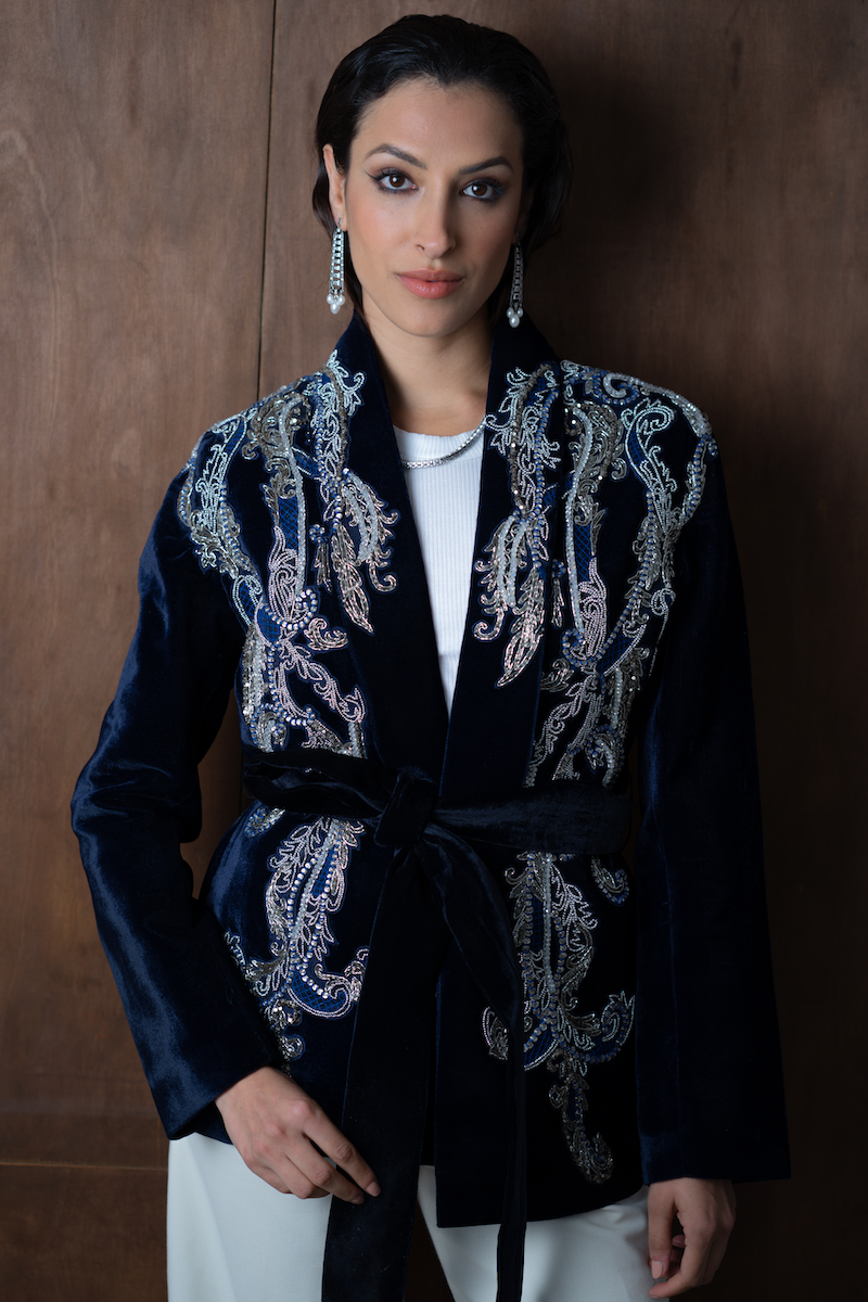 Nadya Shah Manal midnight blue velvet smoking jacket with satin lapels, showcased on a hanger against a neutral background.